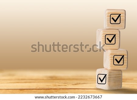 Checklist concept, wooden blocks cubes with icons