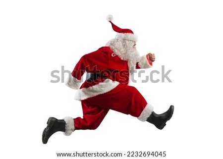 Santa claus runs fast to deliver for Christmas eve Royalty-Free Stock Photo #2232694045