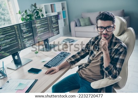 Photo of busy smart programmer wear spectacles arm hand chin testing modern device system indoors workplace workshop home