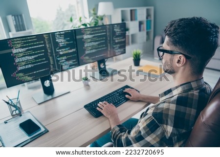 Photo of busy confident guy wear glasses typing keyboard modern device indoors workstation workshop home