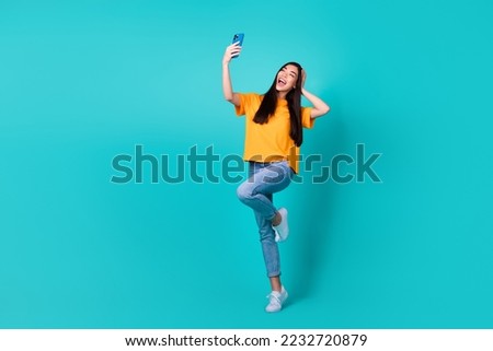 Full size photo of cute brunette lady do selfie wear t-shirt jeans shoes isolated on turquoise color background