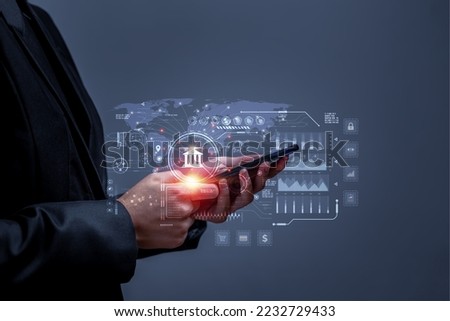 Business people using mobile phone to conduct financial transactions through internet all over the world. Concept of cyber banking services for financial transactions, investments through internet. Royalty-Free Stock Photo #2232729433
