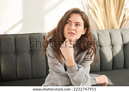 woman making difficult decision, reasoning, weighing pros and cons Royalty-Free Stock Photo #2232747951