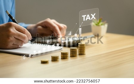 Tax payment and tax deduction planning involve strategies to minimize tax liability. This includes maximizing deductions and credits, deferring income, and accelerating deductions. tax professional Royalty-Free Stock Photo #2232756057
