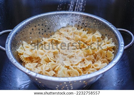 Cooked Pasta in a Colander  Royalty-Free Stock Photo #2232758557