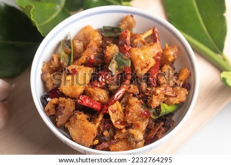 Spicy fried pork crackling chili paste. Thai food. Royalty-Free Stock Photo #2232764295