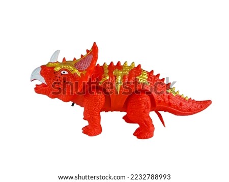 Triceratops child plastic toy dinosaur red yellow color isolated on white background. Perfect for displaying promotional products