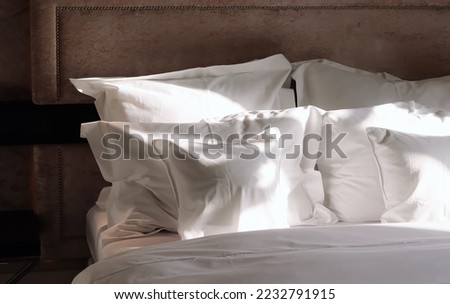 Home decor and interior design, bed with white bedding in luxury bedroom, bed linen laundry service and furniture details Royalty-Free Stock Photo #2232791915