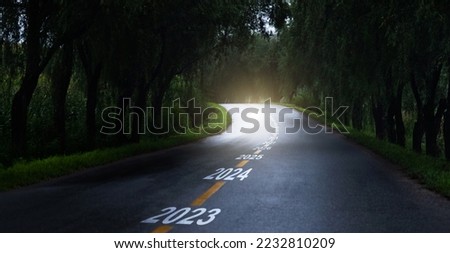 New year 2023 to 2034 on highway middle marking Royalty-Free Stock Photo #2232810209