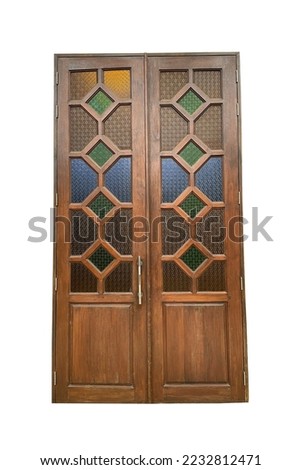 Isolated Wooden door, double doors, closed-open Each panel has 4 rectangular wooden compartments decorated with beautiful stained glass. Soft and selective focus.