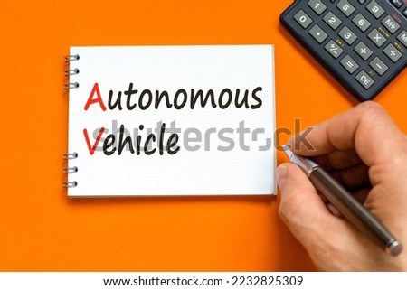 AV autonomous vehicle symbol. Concept words AV autonomous vehicle on white paper on a beautiful yellow background. Business technology AV autonomous vehicle concept. Copy space.