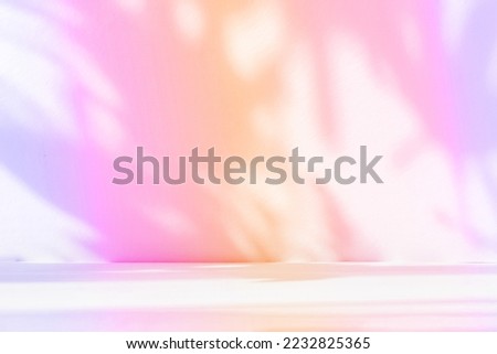 Abstract gradient pink studio background for product presentation. Empty room with shadows of window and flowers and palm leaves . 3d room with copy space. Summer concert. Blurred backdrop. Royalty-Free Stock Photo #2232825365