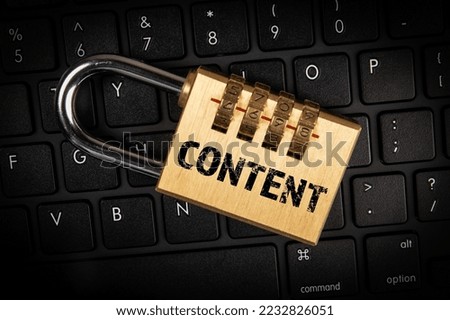 Content concept. Padlock with a code on the computer keyboard.