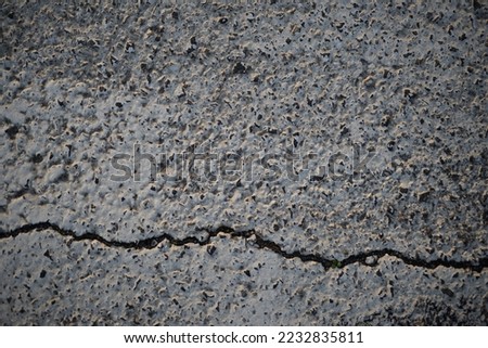 texture of white paint for road marking on asphalt, texture of painted asphalt cracked texture white background, white background on gray asphalt, pedestrian crossing, new road marking close up	 Royalty-Free Stock Photo #2232835811