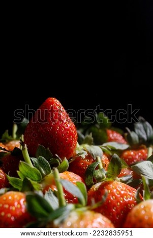 strawberries in dark background. healthy fruits with vitamin C. 