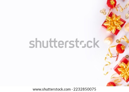 Chinese New Year on white background. Lunar New Year  greeting card with traditional festival decoration - ginkgo biloba, golden twigs, gift boxes, red berries, gift envelopes, coins, chinese lanterns