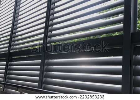 large aluminum louvers There was light coming in from outside. Royalty-Free Stock Photo #2232853233