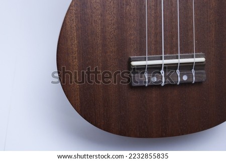 Photograph of a ukulele, a stringed musical instrument.