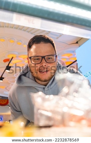 Man looking for vegetable Taking Products From Shelf of the shop Couple Customers Shopping With Checklist
