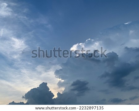 Stratocumulus clouds appears in the sky due to low convection in the atmosphere puffy and gray in color. They tend to form in lumpy rows. can see gray and blue sky at Thailand.no focus
