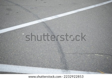 concrete parking, road path and grass, sustainable environment, sustainable development white lines on asphalt, road markings white stripes asphalt road, parking spaces, concrete gray road surface