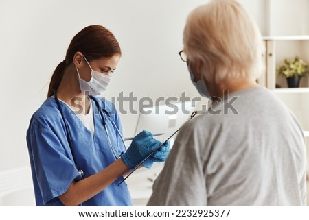 elderly woman and doctor discussion treatment
