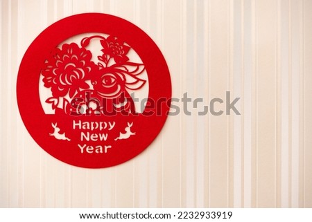a Chinese New Year of Rabbit paper cut decoration on the wall at horizontal composition with copy space
