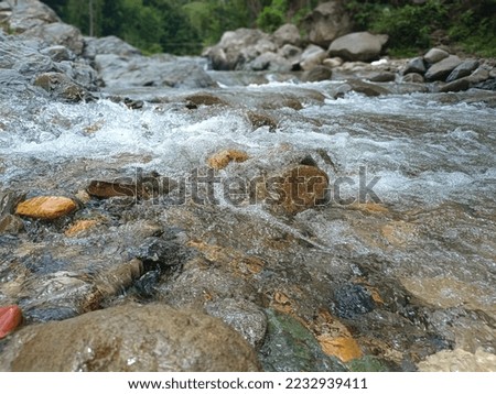 beautiful river with flowing water and rocks