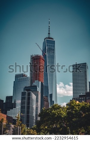 The New York City skyline on a blue sky day.