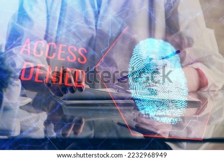 Blue fingerprint hologram over hands taking notes background. Concept of security. Double exposure Royalty-Free Stock Photo #2232968949