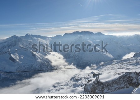 Sunny day on a Hintertux glacier (photo taken from 3250 meters above sea level) with view of Tirol Alps