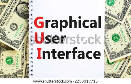 GUI graphical user interface symbol. Concept words GUI graphical user interface on white note on a beautiful background from dollar bills. Business and GUI graphical user interface concept. Copy space