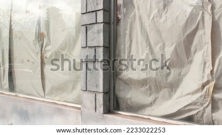 Covering paper in shop window