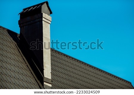 Part of the roof of the roof of the house;
chimney from the roof of gray color
