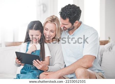 Education, learning and girl with parents and tablet for cartoon, movie or video on the web. Social media, connection and mother and father with an app on technology and child in their family home