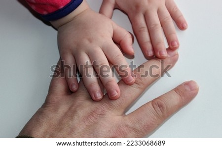 Children's hands hold the fingers of an adult's hand free royalty stock photo
