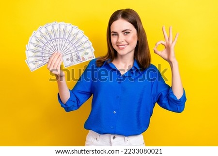Photo of charming satisfied lady wear blue clothes got credit ukrainian bank hand show okey symbol isolated on yellow color background