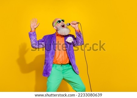Photo of popular famous vocalist gentleman wear stylish velvet costume outfit enjoy event empty space isolated on yellow color background Royalty-Free Stock Photo #2233080639