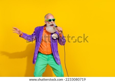Photo of pensioner man sing mic at karaoke club concert isolated on bright color background Royalty-Free Stock Photo #2233080719