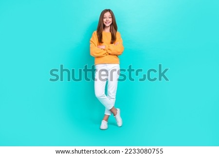 Full length photo of glad schoolgirl wear stylish trendy outfit folded hands smiling good mood after nice shopping day isolated on cyan color background