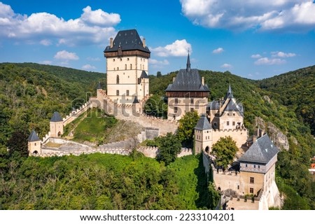 Royal Castle Karlstejn. Central Bohemia, Karlstejn village, Czechia. Aerial view to The Karlstejn castle. Royal palace founded King Charles IV. Amazing gothic monument in Czech Republic, Europe. Royalty-Free Stock Photo #2233104201