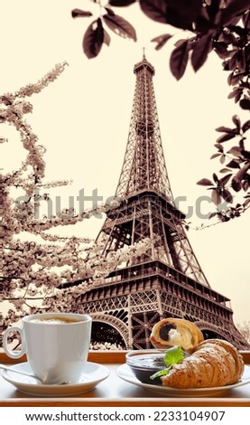 Hot Coffee with croissants served on a wooden tray against Eiffel Tower in Paris, France