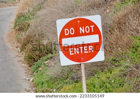 Sign do not enter red and white in front of uphill road