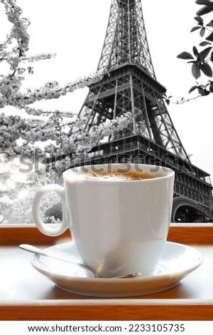 Delicious hot coffee served on a wooden tray against Eiffel Tower in Paris, France