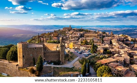 View of Montalcino town, Tuscany, Italy. The town takes its name from a variety of oak tree that once covered the terrain. View of the medieval Italian town of Montalcino. Tuscany Royalty-Free Stock Photo #2233105811