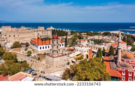 Panoramic view of Rhodes old town on Rhodes island, Greece. Rhodes old fortress cityscape with sea port at foreground. Travel destinations in Rhodes, Greece. Royalty-Free Stock Photo #2233106743