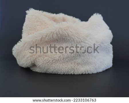 FLUFFY WHITE SCARF WITH BLACK BACKGROUND.
WHITE NECKWEAR WITH BBLACK SOLID BACKGROUND. Royalty-Free Stock Photo #2233106763