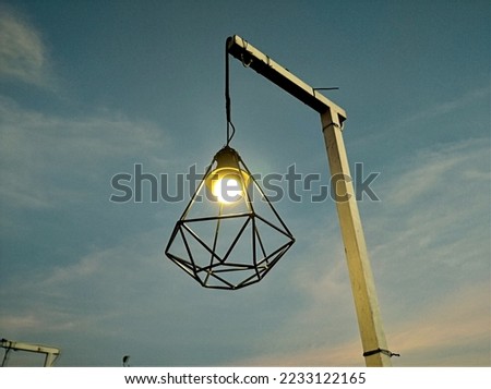 pendant lamp used for outdoor lighting, Yogyakarta, Indonesia. Take a picture that is much lower than the object or Frog view angle