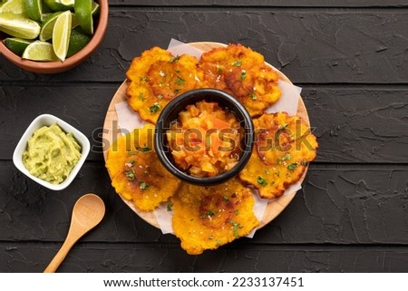 Fried plantain patacon - Colombian traditional food Royalty-Free Stock Photo #2233137451