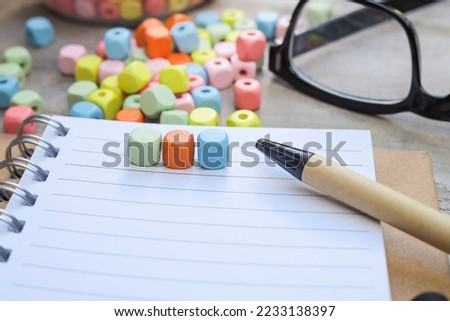 Colorful cubes on the notebook. Business and education concept